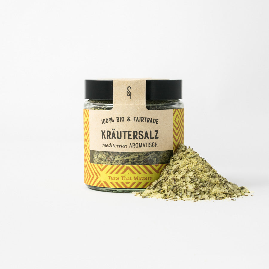 Bio Kräutersalz in Glasverpackung mit Gewürzhäufchen von vorne