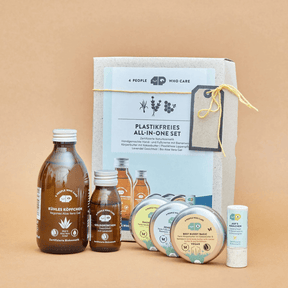 Plastikfreies All-in-One Set, mit Bienenwachs vor orangene Hintergrund