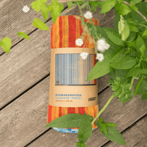 Langbrett Klimahandtuch 2024 zusammengerollt in Verpackung