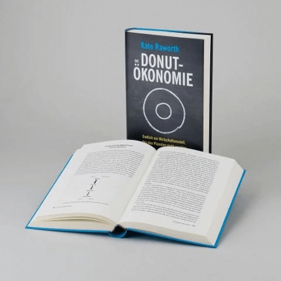 Die Donut-Ökonomie stehend und aufgeklappt