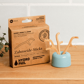 Verpackung Zahnseide Sticks und einzelne Sticks im Zahnbürsten-Halter